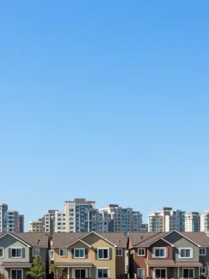 Diverse residential community with new housing developments, symbolizing federal housing initiative impact.