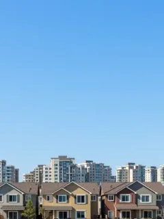 Diverse residential community with new housing developments, symbolizing federal housing initiative impact.