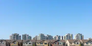 Diverse residential community with new housing developments, symbolizing federal housing initiative impact.