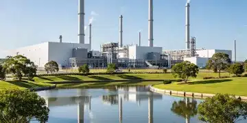 EPA Regulations: Cutting Industrial Emissions by 10% Over 5 Years Industrial complex with smokestacks and green environment under new EPA regulations
